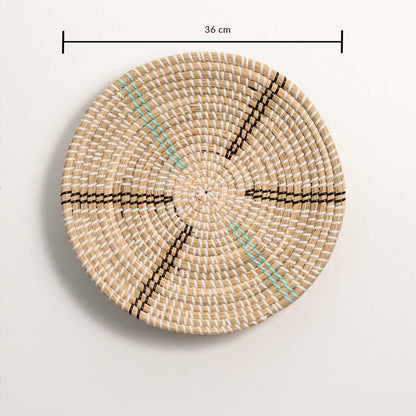 Woven wall basket measuring 36 cm in diameter with turquoise and black linear detailing and symmetrical hand-woven texture.