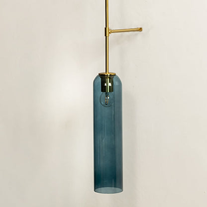 Closeup showing smooth blue glass cylinder shade and slender metal support arm highlighting refined craftsmanship suited for modern upscale interior home decor lighting.