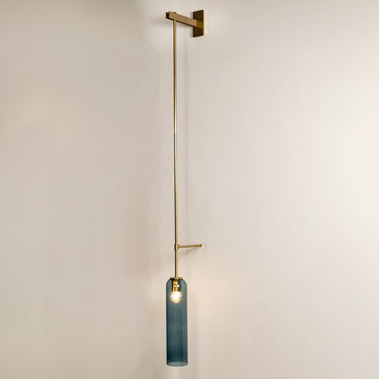 Minimal wall pendant light with gold metal arm and blue glass accent ideal for modern bedroom or living room wall decor.