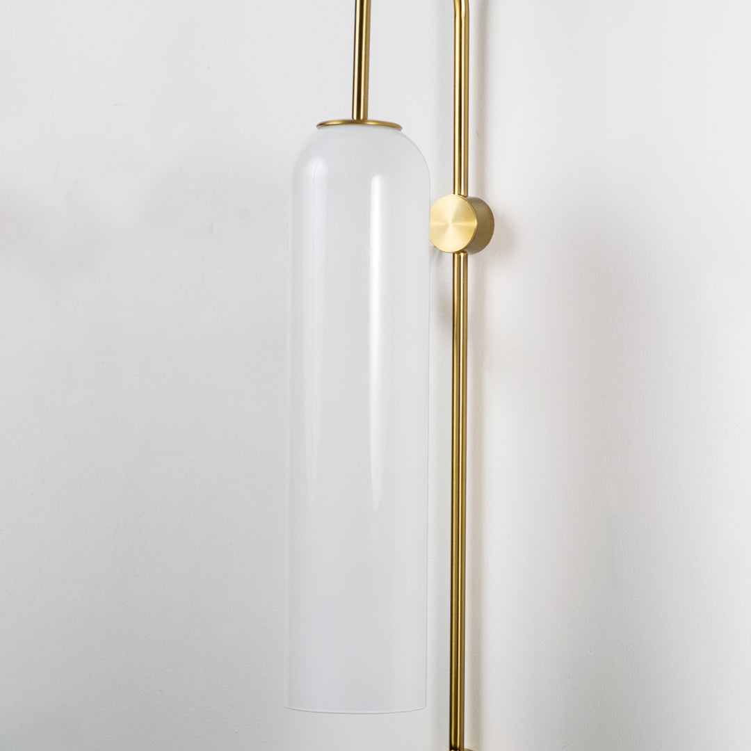 Closeup of frosted glass and gold metal wall light for modern hallway and premium decor styling spaces.