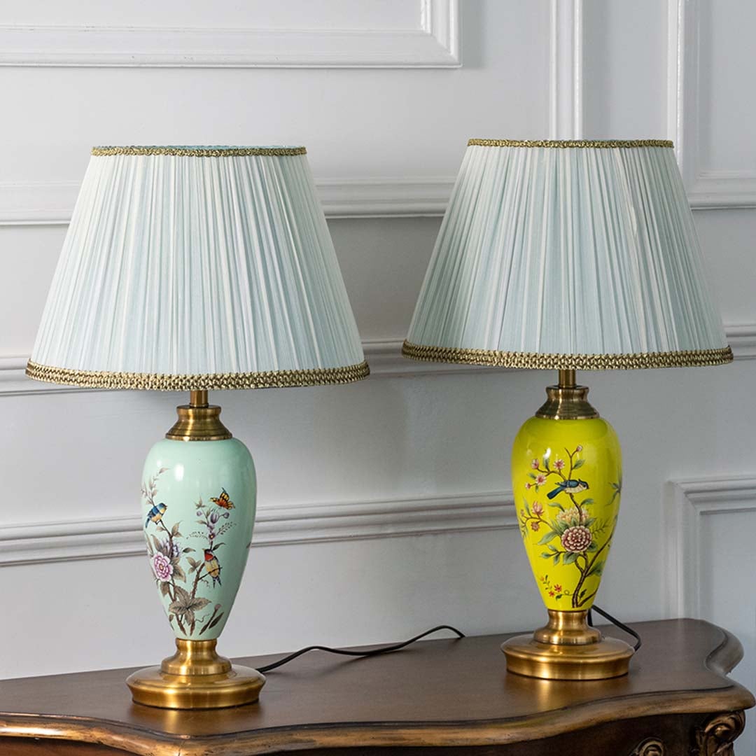 Mint green hand-painted floral table lamp turned off on white background showcasing intricate design and smooth glossy finish.