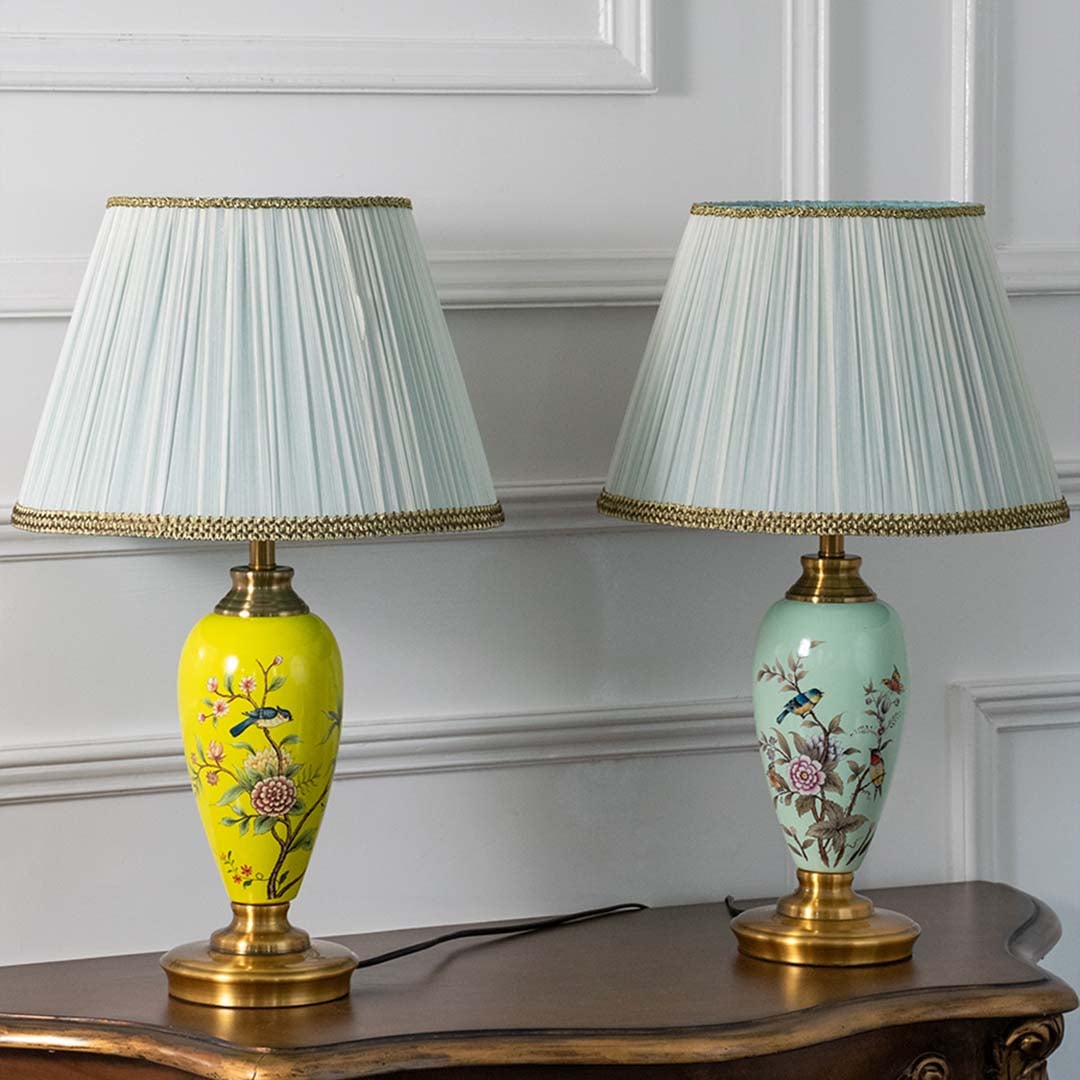 Set of floral hand-painted ceramic table lamps in assorted colors turned off showcasing artistic craftsmanship and rich color variety perfect for home styling.