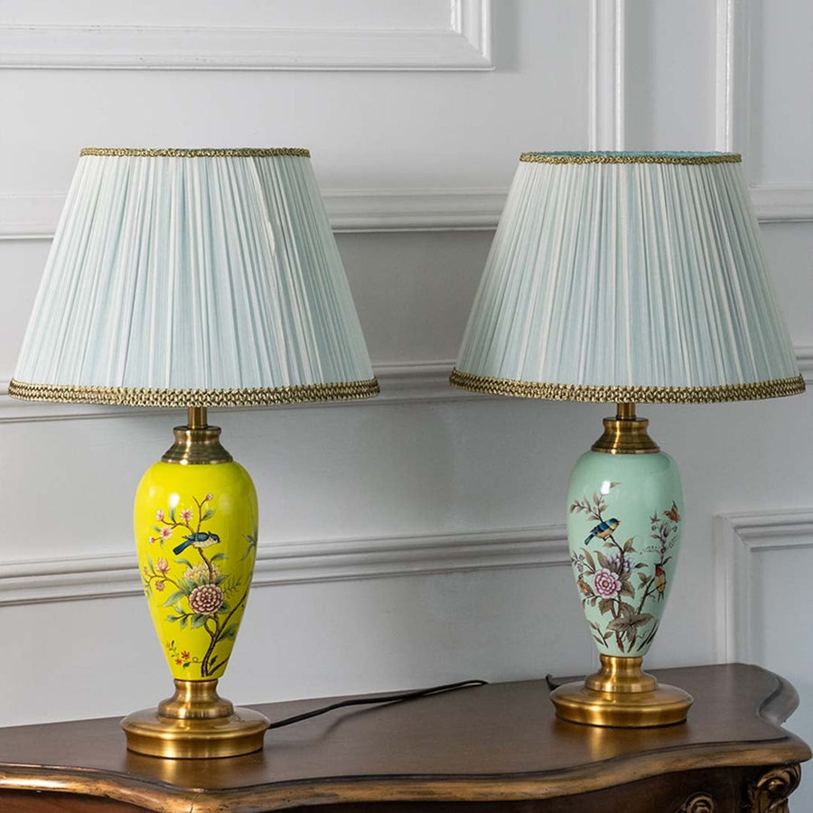 Set of floral hand-painted ceramic table lamps in assorted colors turned off showcasing artistic craftsmanship and rich color variety perfect for home styling.