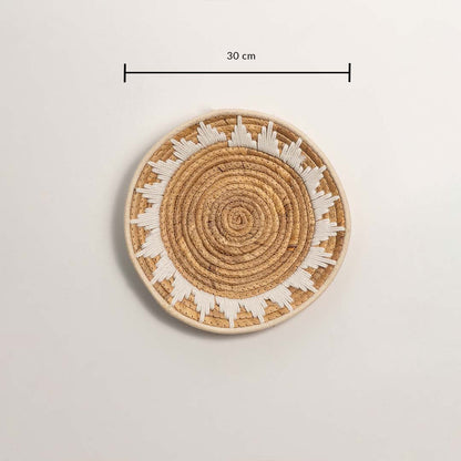 Medium round woven wall basket measuring 30 cm in diameter featuring natural beige coils and white accents displayed on white.