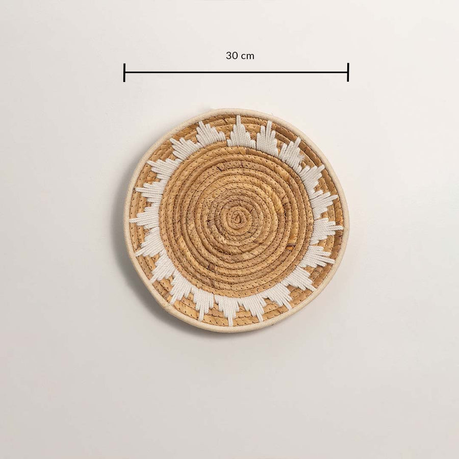 Medium round woven wall basket measuring 30 cm in diameter featuring natural beige coils and white accents displayed on white.