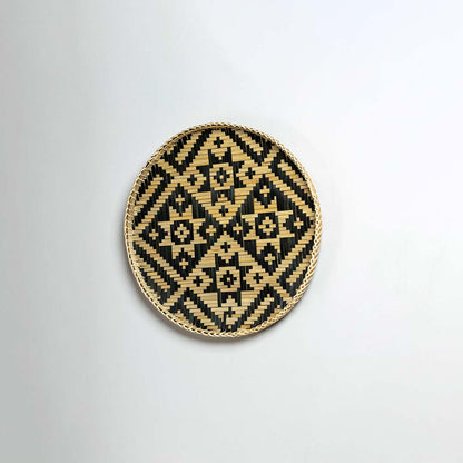 Side view of bamboo wall plate highlighting its raised rim durable weave and neat handcrafted finish.