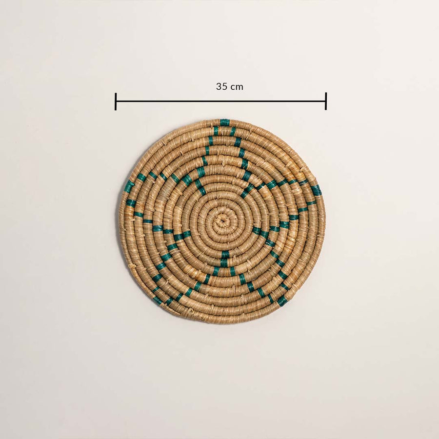 Medium round woven wall basket measuring 35 cm in diameter featuring natural beige coils and teal accents displayed on white.