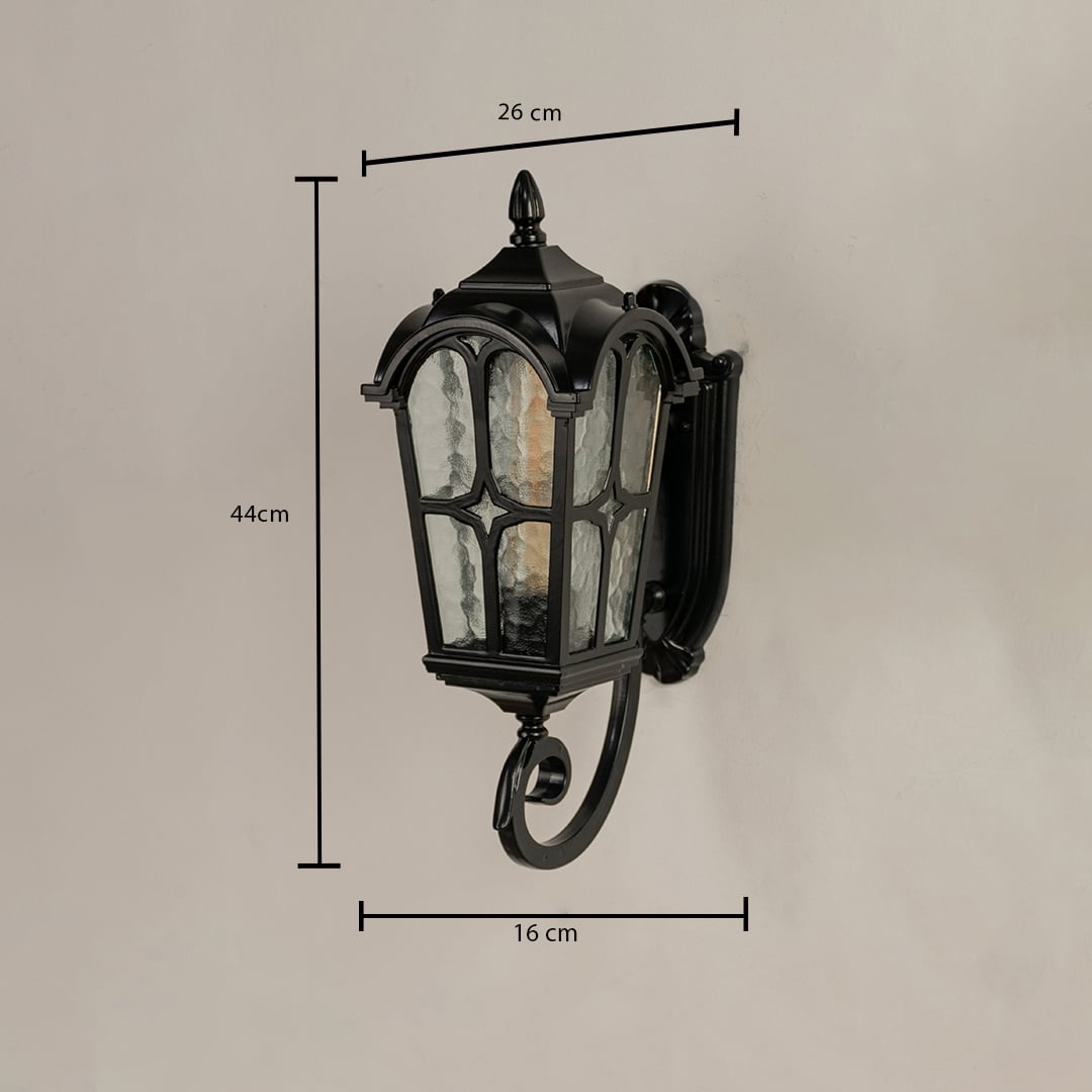 Outdoor lantern showing dimensions of 44 cm height 26 cm width and 16 cm depth with curved metal design.