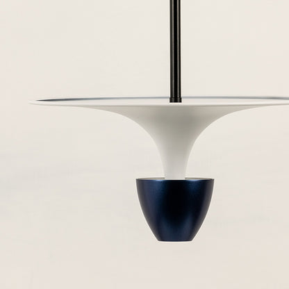 Closeup of white pendant light with dark metallic accent for stylish modern dining room interior decor styling.