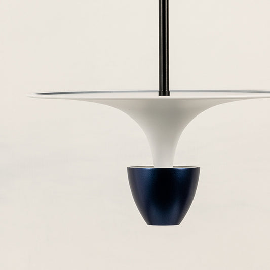 Closeup of white pendant light with dark metallic accent for stylish modern dining room interior decor styling.