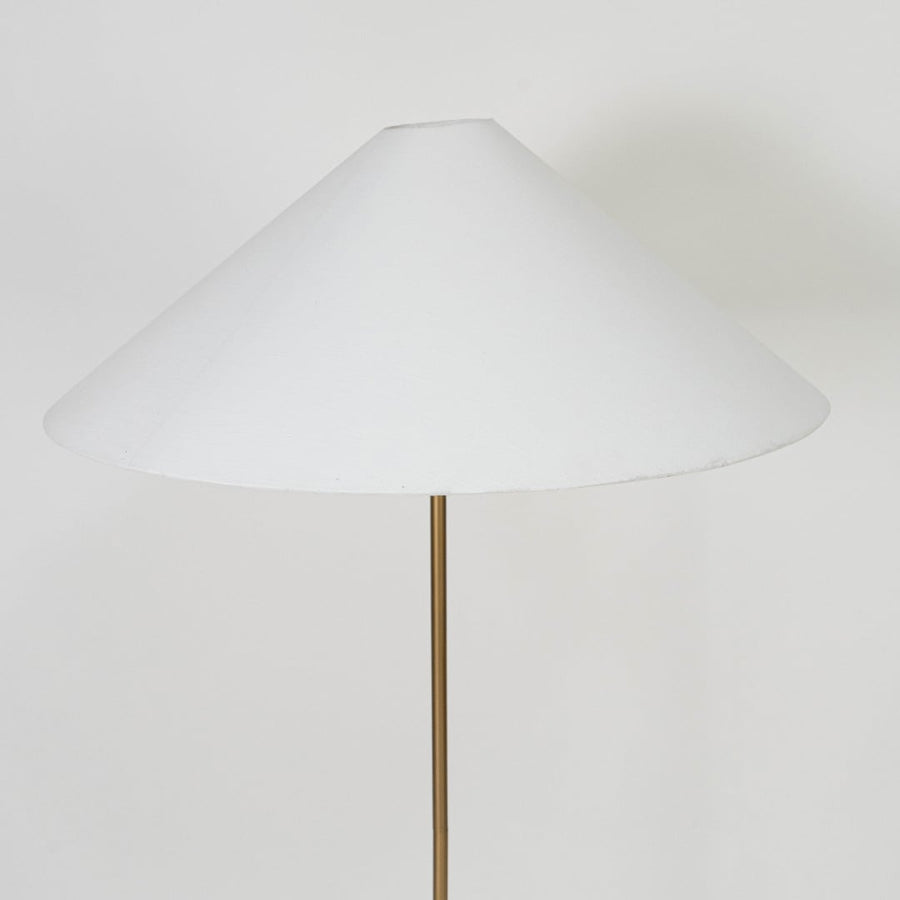 Brushed brass cylindrical lamp base with slim rod support offering sturdy modern design and refined finish.