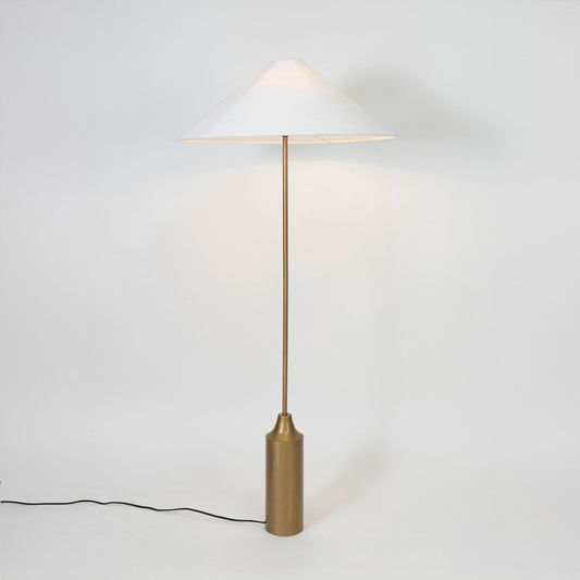 Modern white metal table lamp with white fabric shade for living room bedside table on white background image.