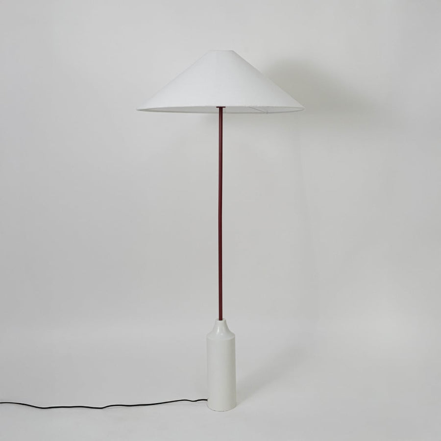 Floor lamp with white conical shade maroon pole and white base shown against plain background for clean product view.