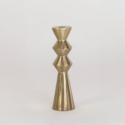 Modern metal candle holder in gold finish with geometric shape for table decor or dining styling contemporary home placement white background.