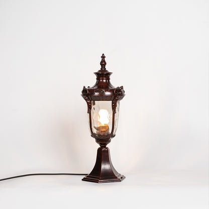 Classic outdoor gate light with antique brown metal finish and glowing glass shade for decor styling.