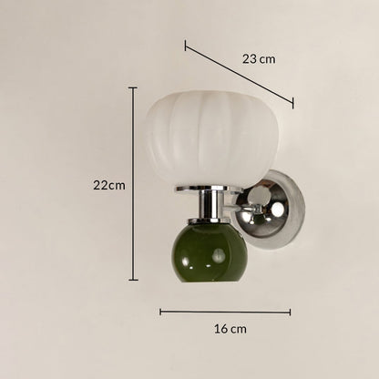 Wall light with white glass shade and green glass accent showing 22 cm height 22 cm width and 16 cm projection.