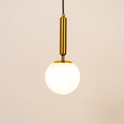 White glass globe pendant light with brass metal holder and minimalist design for elegant contemporary ceiling lighting decor.