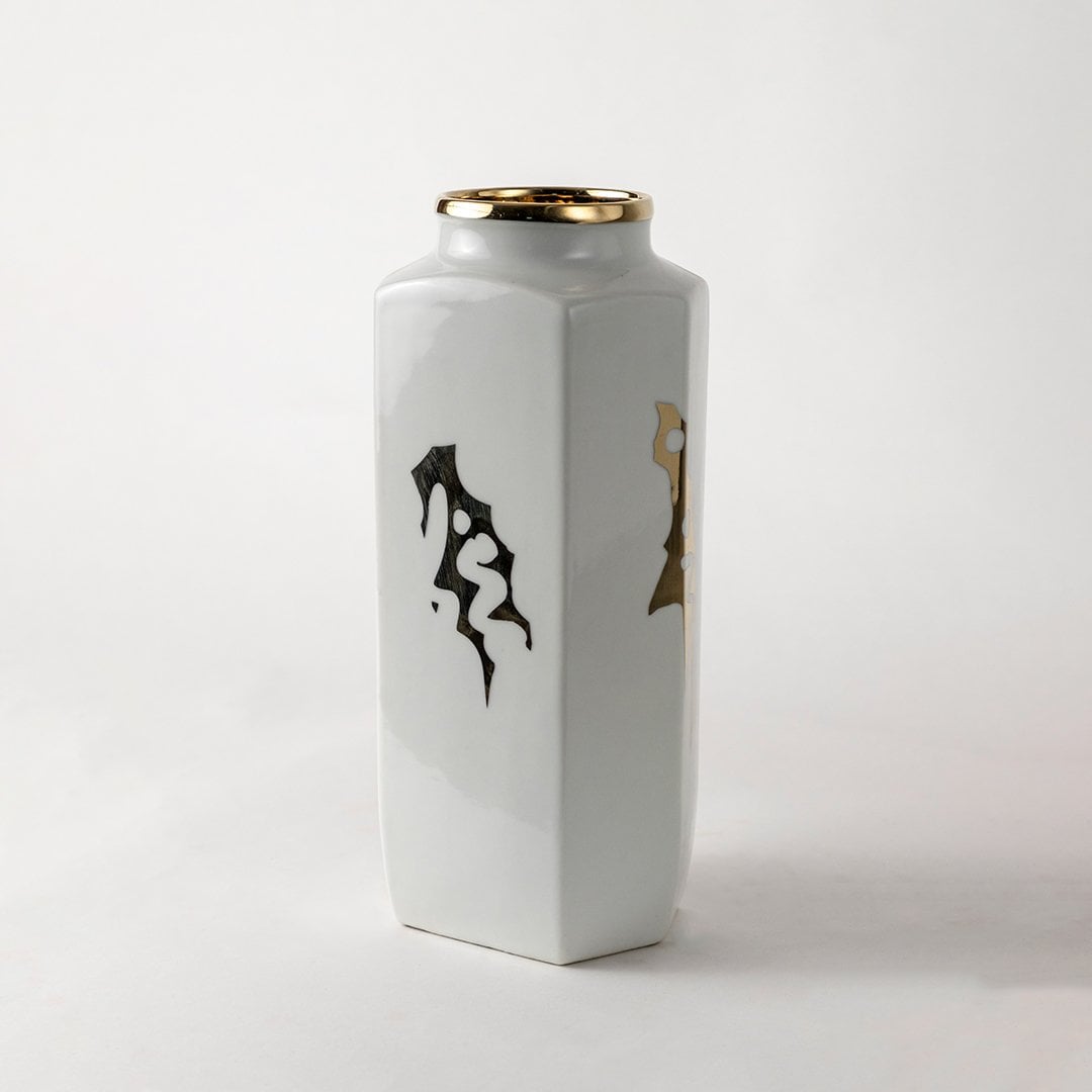 White ceramic jar with black abstract brush artwork in a close-up view perfect for modern console décor and stylish home accents.