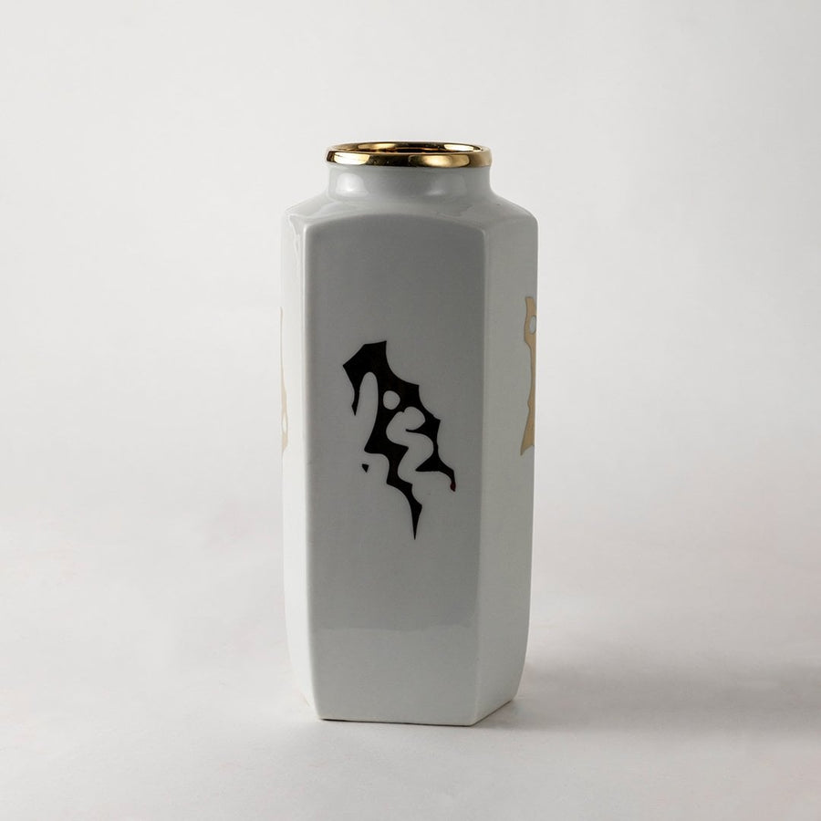 White ceramic jar with black abstract calligraphy design ideal for modern console décor and artistic home styling.