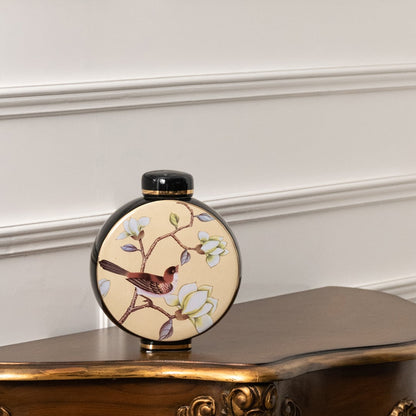 Round ceramic jar with bird and floral artwork perfect for decorative shelf styling and enhancing modern living room décor.