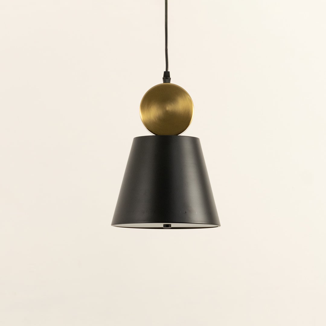 Metal pendant light with black tapered shade and spherical metal detail shown switched off on a white background highlighting its clean modern geometric form.