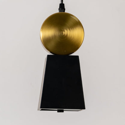 Closeup of pendant light top with gold metal cap and black fabric shade highlighting refined finish premium materials and elegant detailing.