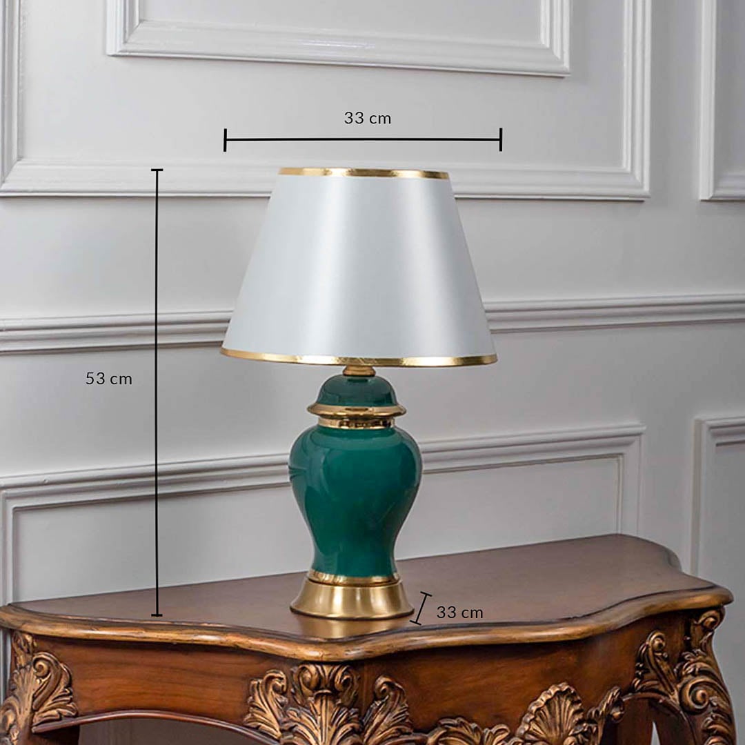 Green ceramic table lamp with gold base and white lampshade showing 53 cm height and 33 cm width.