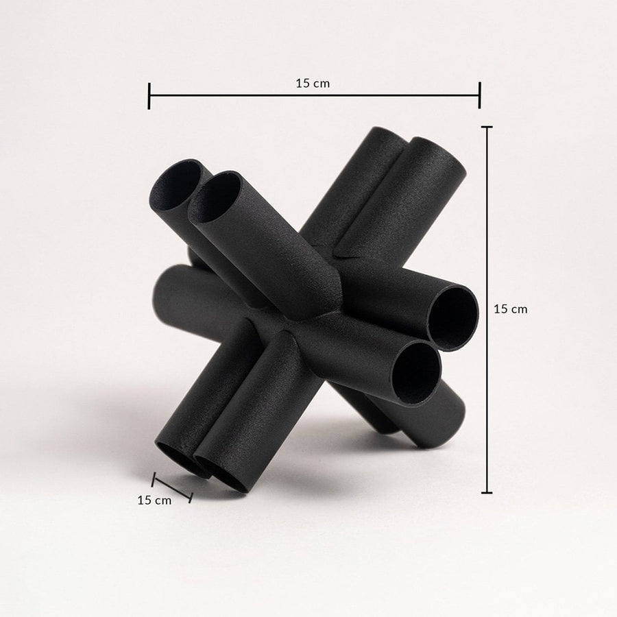 Black geometric decor sculpture shown in 15 cm height 15 cm width and 15 cm depth for accurate sizing.