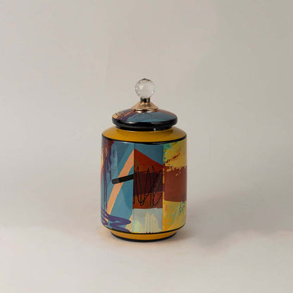 Multicolor ceramic jar against white background highlighting glossy surface and rich abstract brushstroke details.