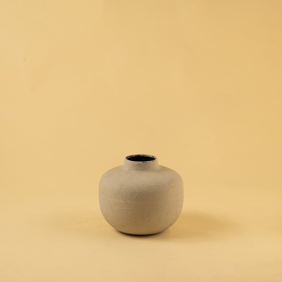 Grey metal textured vase decor on a clean white background highlighting its modern matte finish for versatile home styling.