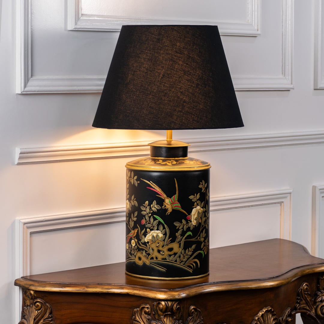 Elegant pendant light with black metal shade and wooden accent hanging above a modern dining table creating warm ambient lighting for stylish home interiors.