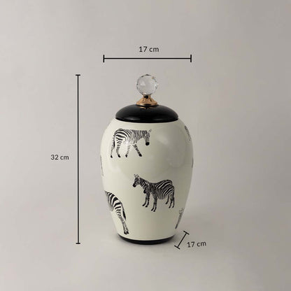 White ceramic decor jar with zebra artwork and crystal knob shown with 32 cm height and 17 cm width dimensions.
