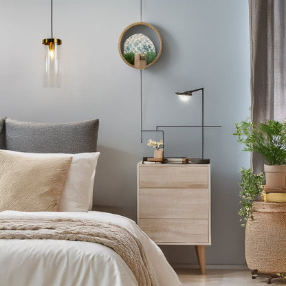 Metal cage pendant light illuminating a natural balcony setting with wicker chair earthy decor and potted plants creating a warm and relaxed outdoor vibe.