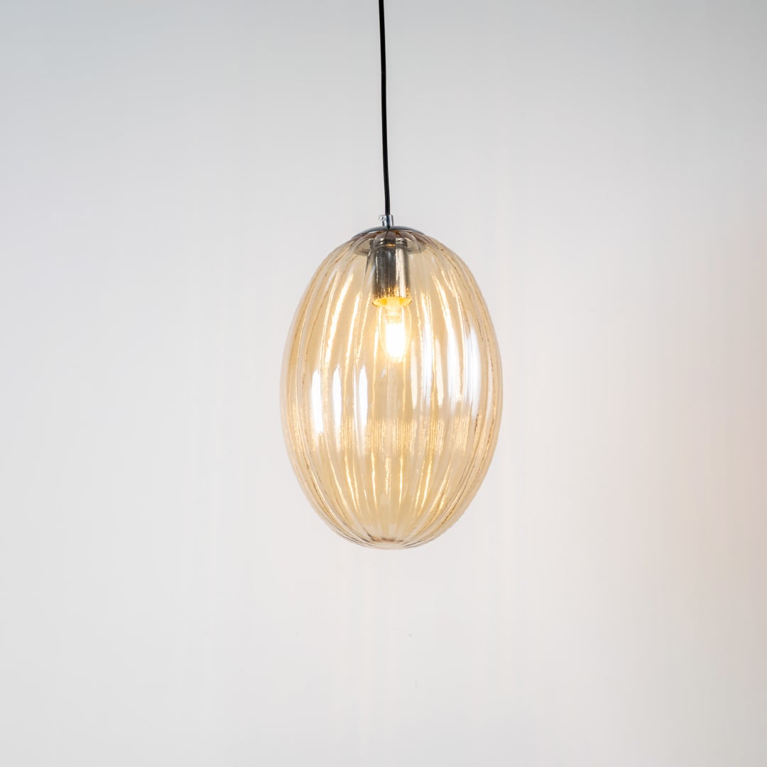 Pendant light turned on against a clean white background showing its warm illumination and highlighting its shape and detailing clearly.