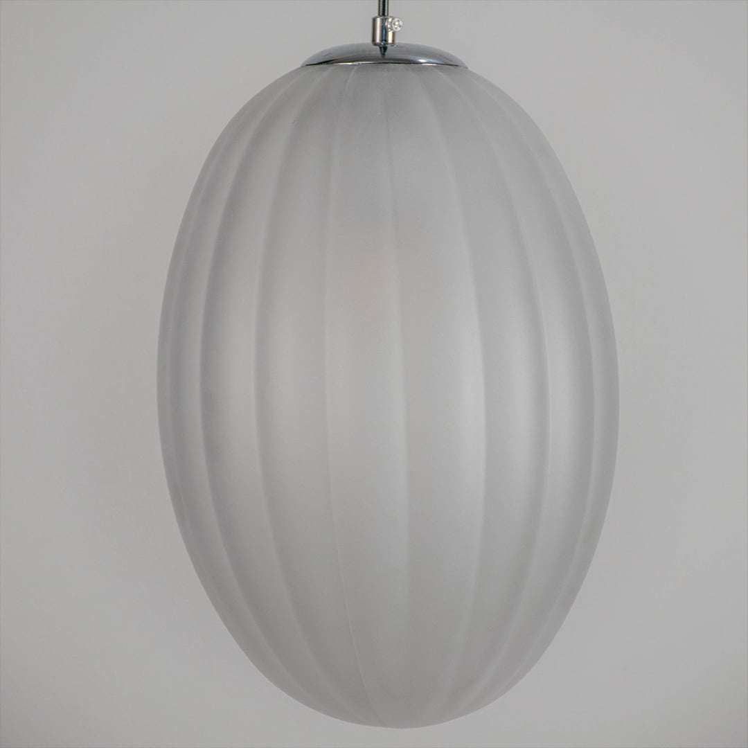 Closeup view of frosted ribbed glass pendant light shade showcasing smooth matte texture soft diffusion and elegant ceiling lighting style.