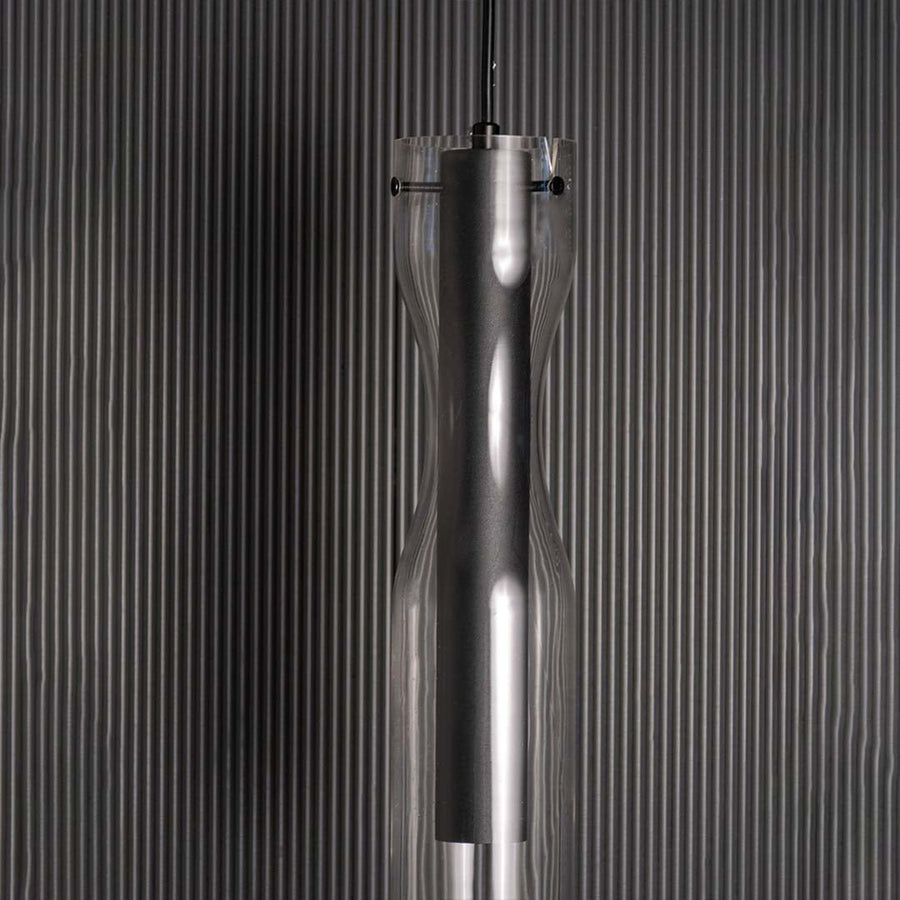 Zoomed view of the pendant light showing the smooth black inner cylinder and crystal clear outer glass layer crafted for a refined contemporary look.