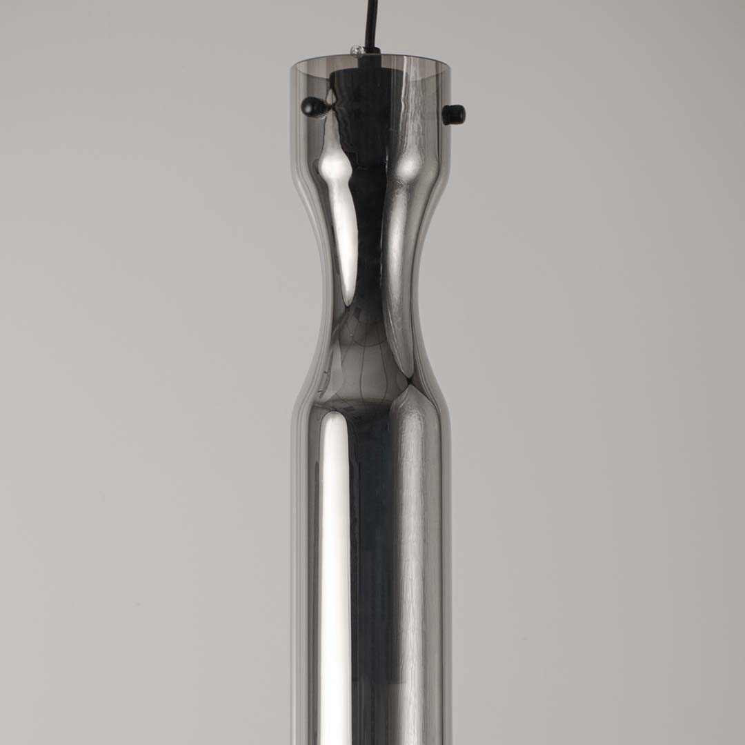 Sleek metallic pendant light with chrome finish on neutral background modern minimal lighting ideal for kitchen and dining decor.