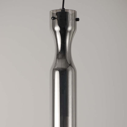 Sleek metallic pendant light with chrome finish on neutral background modern minimal lighting ideal for kitchen and dining decor.