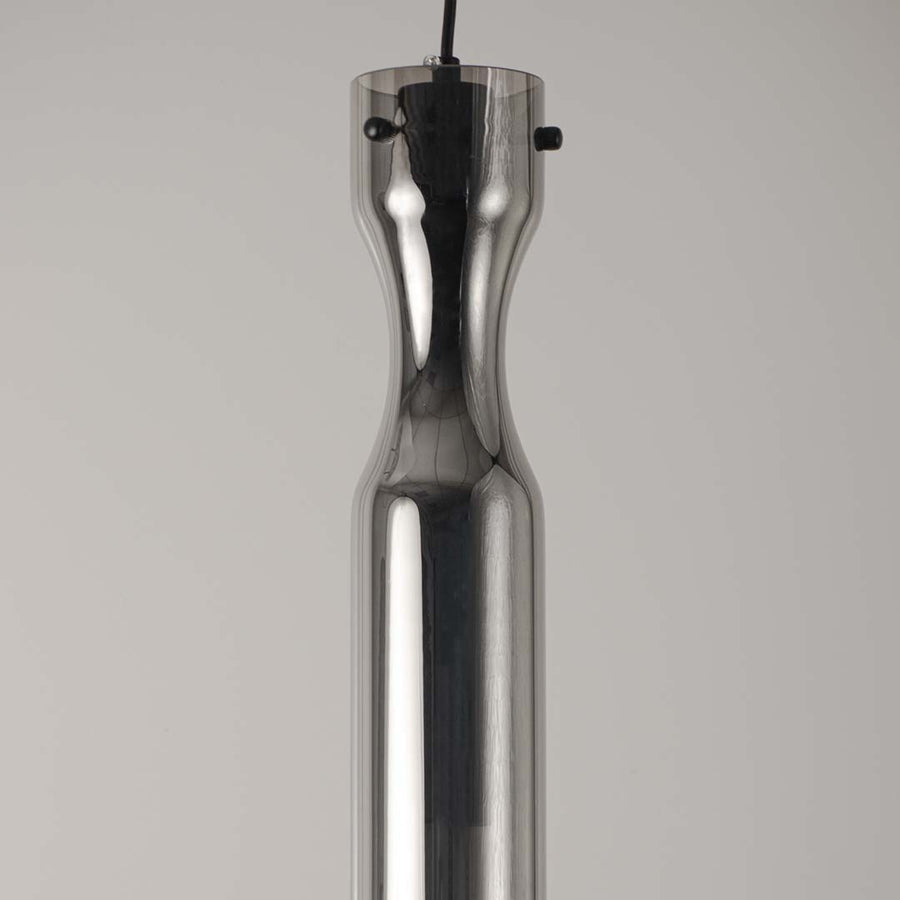 Sleek metallic pendant light with chrome finish on neutral background modern minimal lighting ideal for kitchen and dining decor.
