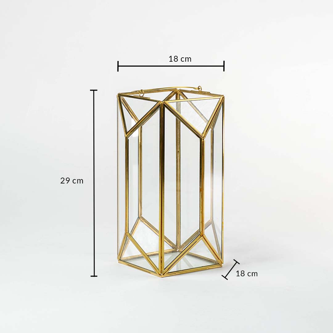 Gold metal and glass geometric candle lantern shown with dimensions 29 cm height and 18 cm width ideal for living room bedroom or hallway decor placement.