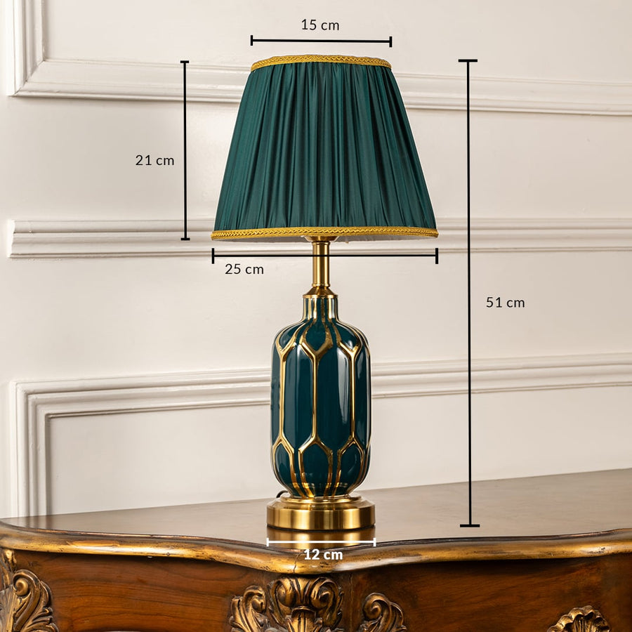 Table lamp shown with 51 cm height and 15 cm shade width featuring emerald ceramic patterned base pleated green shade and metal accents ideal for elegant interior home decor lighting.
