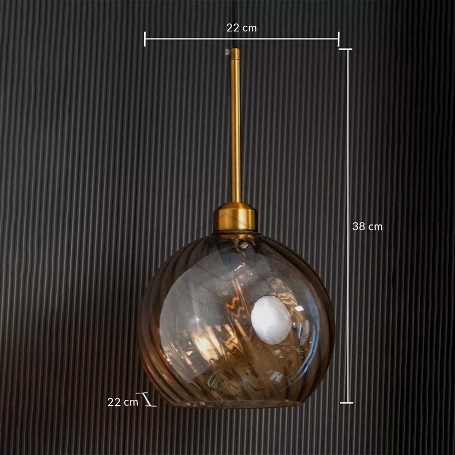 A detailed close view of the gold and smoked glass pendant light highlighting the swirled smoky glass finish suited for modern luxury interiors.