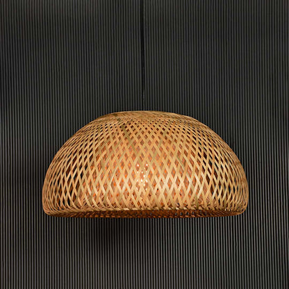 Handwoven rattan pendant light with natural texture designed for bohemian decor.