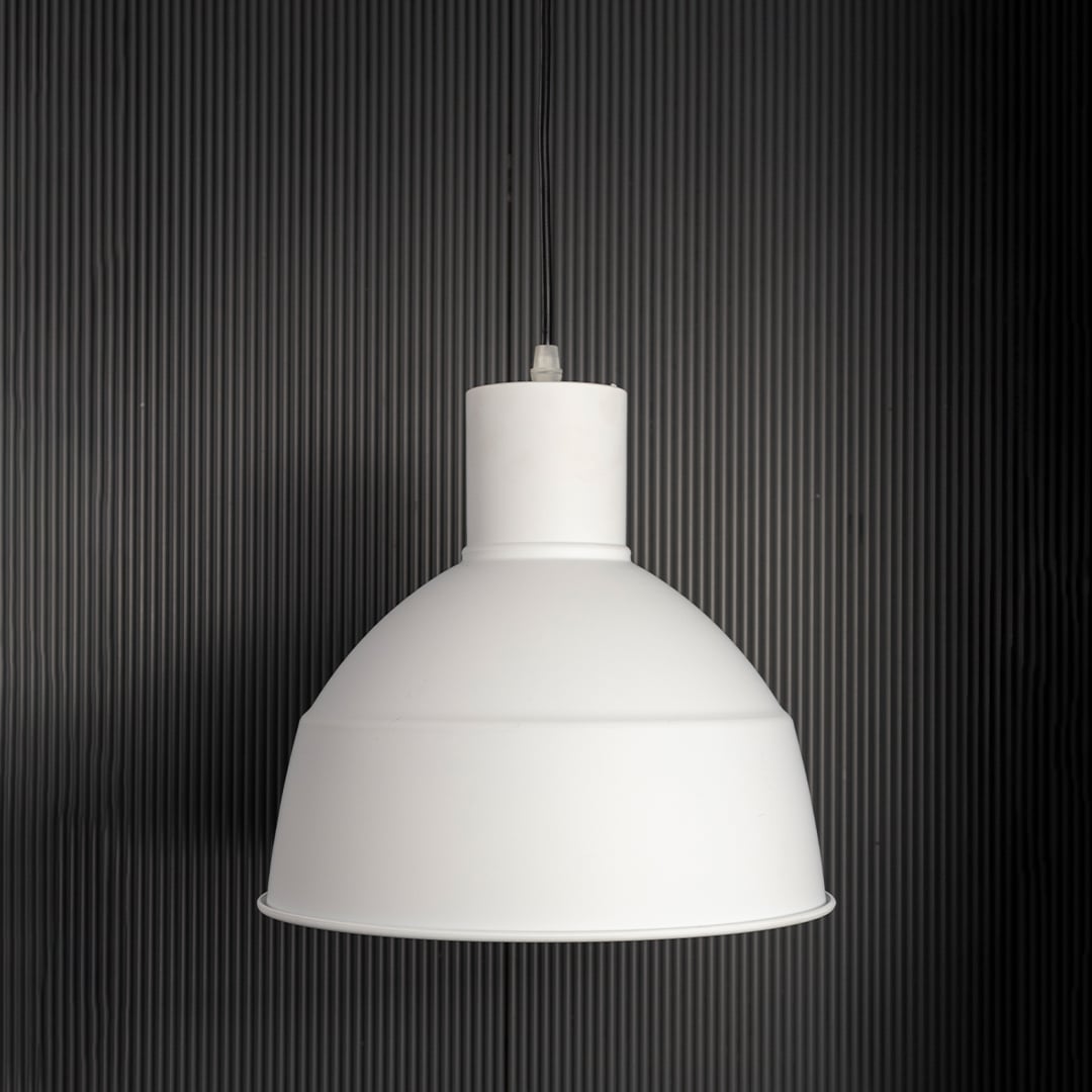 Sleek white industrial pendant light fixture turned off isolated on a pitch black background for a high contrast and dramatic presentation