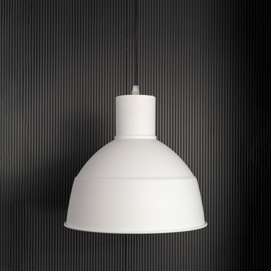Sleek white industrial pendant light fixture turned off isolated on a pitch black background for a high contrast and dramatic presentation