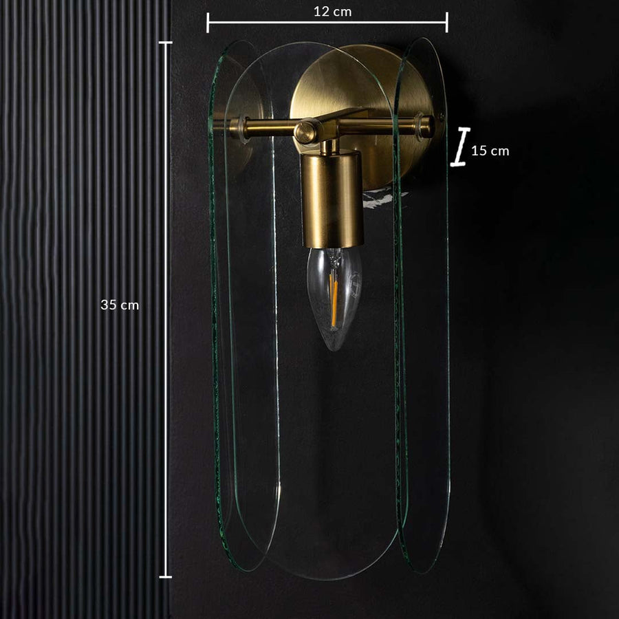 Gold and glass wall light shown with 35 cm height and 12 cm width giving accurate size details for ideal placement in modern interior spaces.