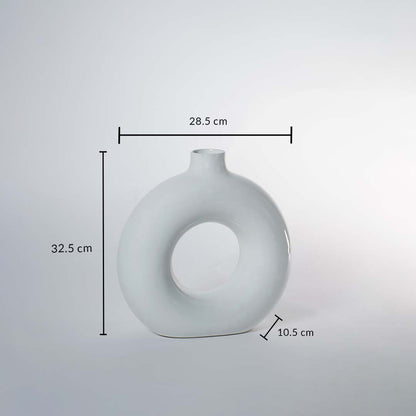 A white circular vase on a white background showing full dimensions clearly marked as 32.5 cm height 28.5 cm width and 10.5 cm depth demonstrating its exact size.