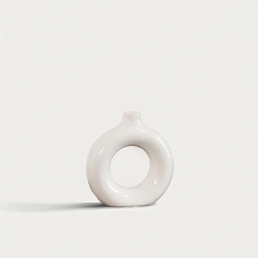 Elegant ceramic donut vase with smooth white finish hollow center design decorative modern vase for home interior styling.