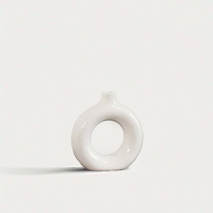 Elegant ceramic donut vase with smooth white finish hollow center design decorative modern vase for home interior styling.