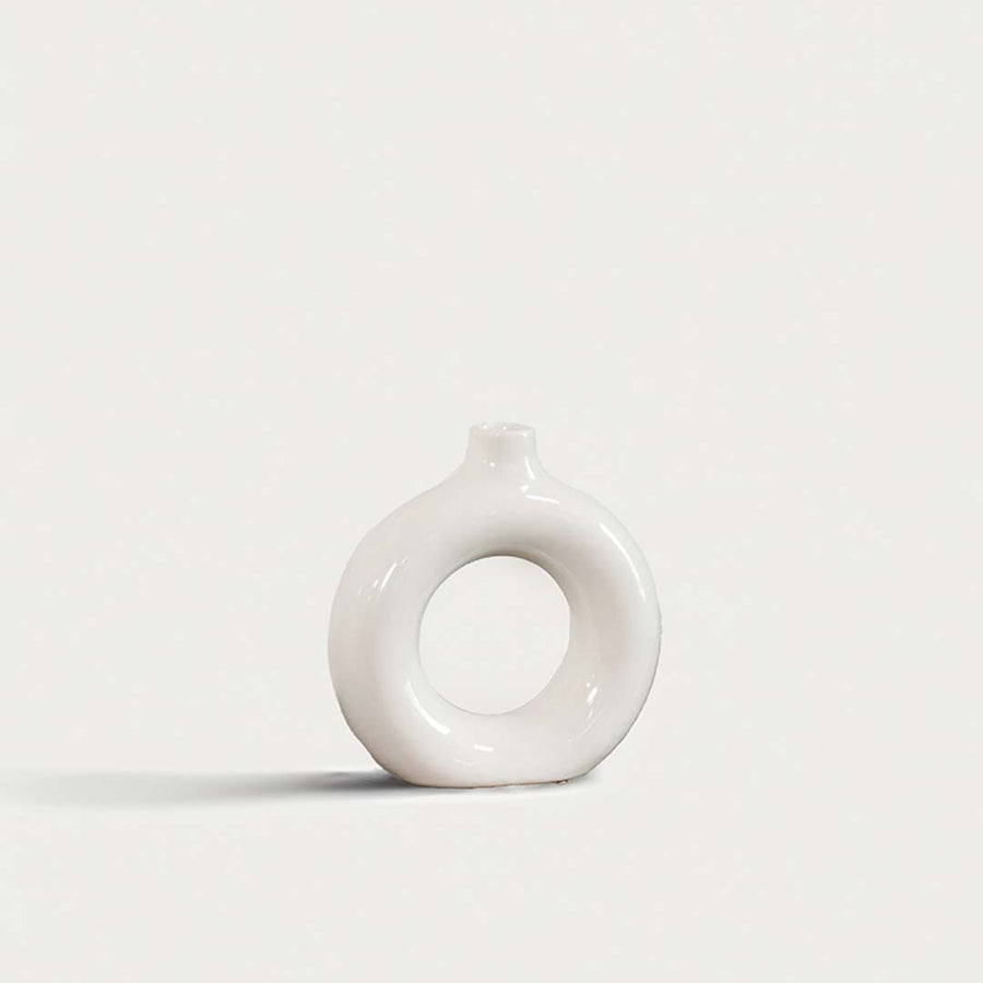 Elegant ceramic donut vase with smooth white finish hollow center design decorative modern vase for home interior styling.